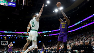 Tatum dominates as Celtics hold off Lakers; James injury scare