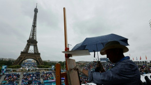 Beach volleyball starts in pouring rain at landmark Paris venue