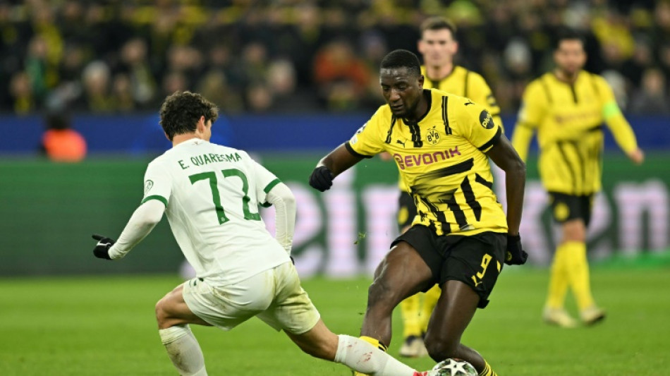 Dortmund ease into Champions League last 16 after Sporting stalemate