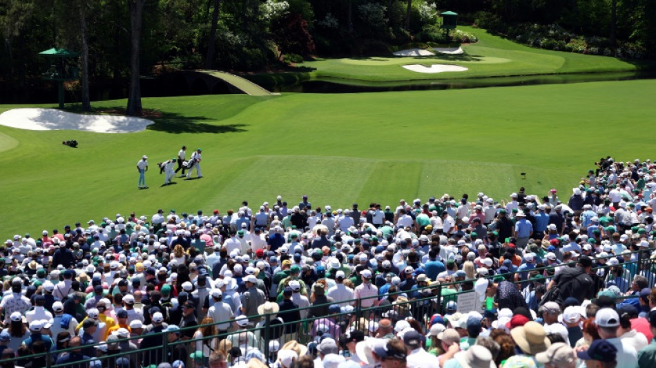 Adoring Augusta cheers Tiger into another Masters weekend