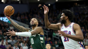 Lillard carries short-handed Bucks over 76ers