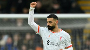 Salah's controversial penalty fires Liverpool nine points clear