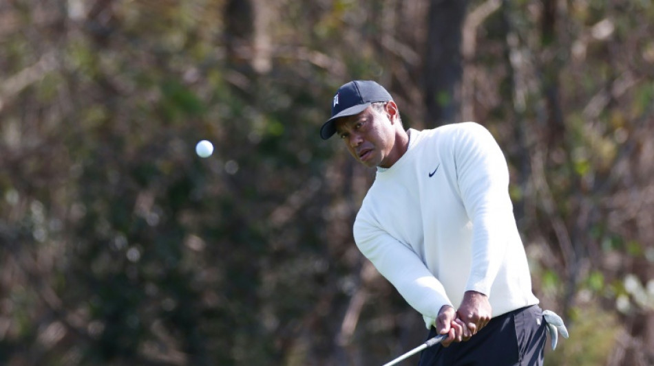 Woods and son Charlie seek title before Tiger rests sore foot