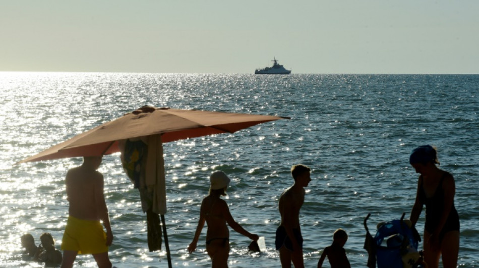 Fighter jets and warships: Russians get a taste of Crimea summer vacation