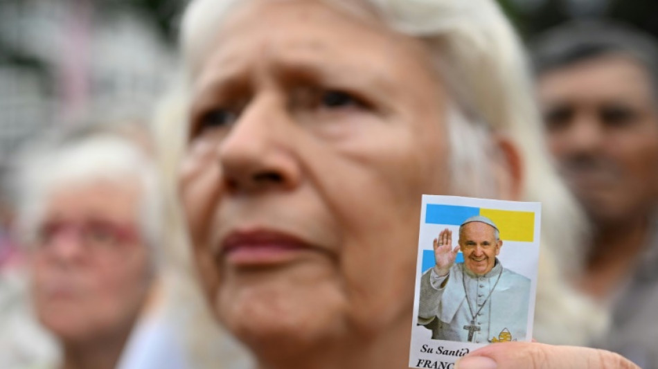 Ailing pope works on saints from hospital as Catholics pray for recovery