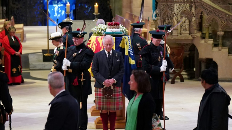 Crowds queue through the night in Scotland for queen