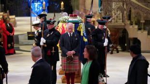 Crowds queue through the night in Scotland for queen