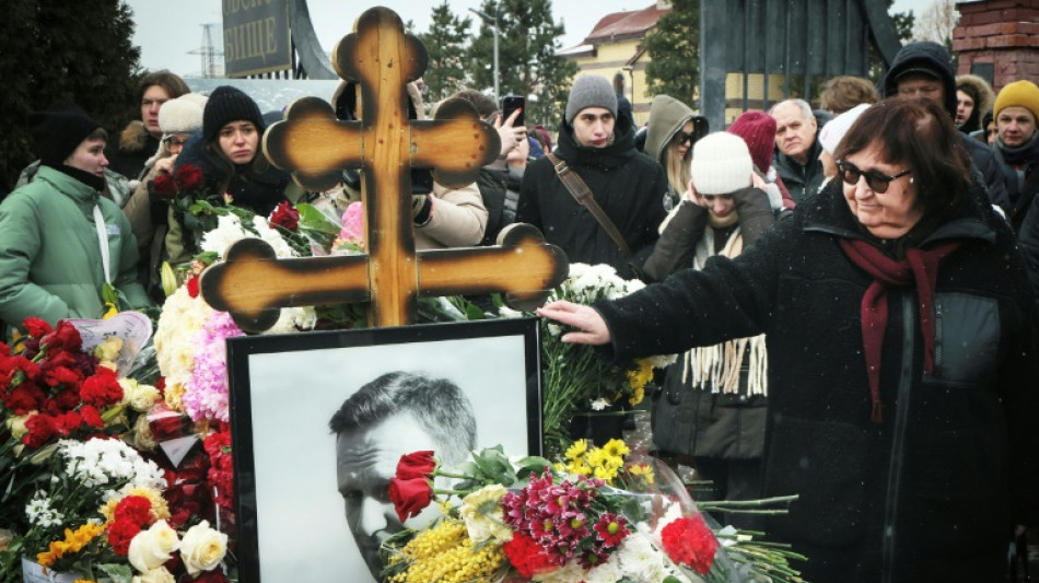 Russians risk reprisals to visit Navalny grave on death anniversary