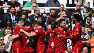 Man City keep Liverpool at arm's length, Norwich relegated