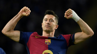 Lewandowski powers five-star Barca to Sevilla rout