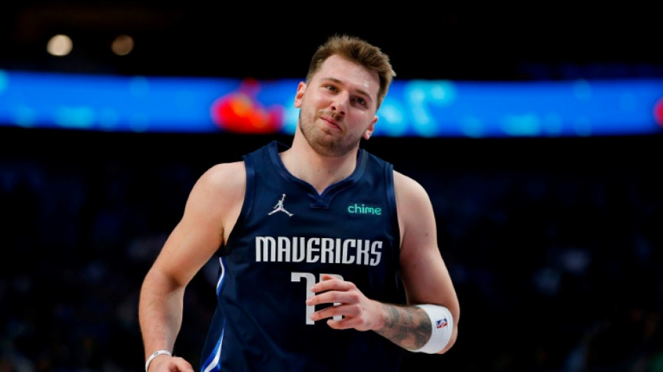 Calf injury slows Doncic as Mavs launch training camp