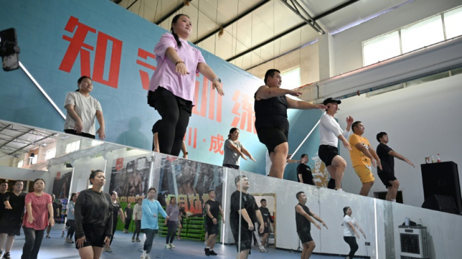 Chinese slimmers trim down at weight-loss camps