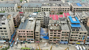 More than 20 trapped, others missing after China building collapse