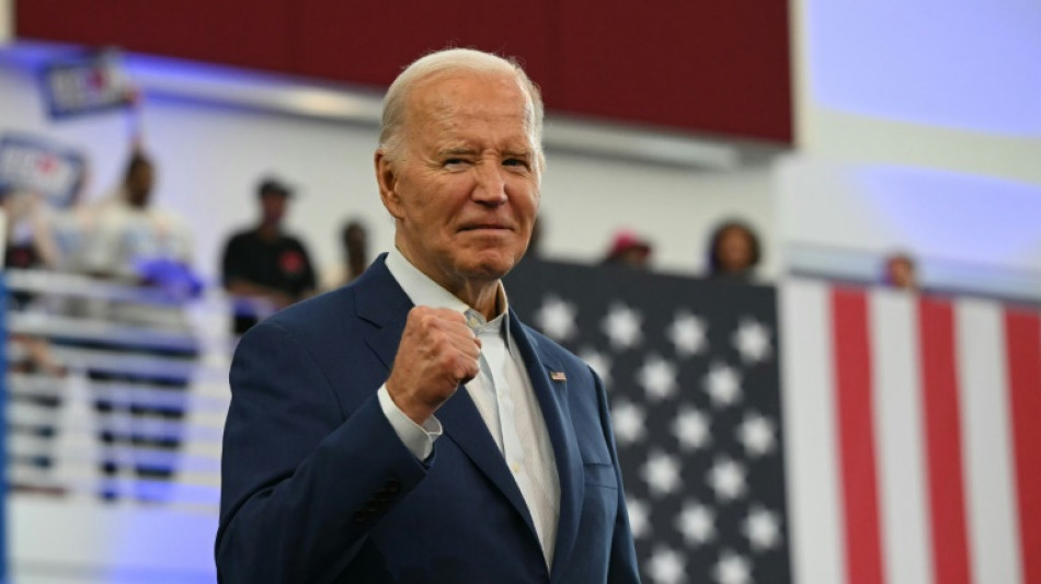 Biden defiant on campaign trail but pressure mounts