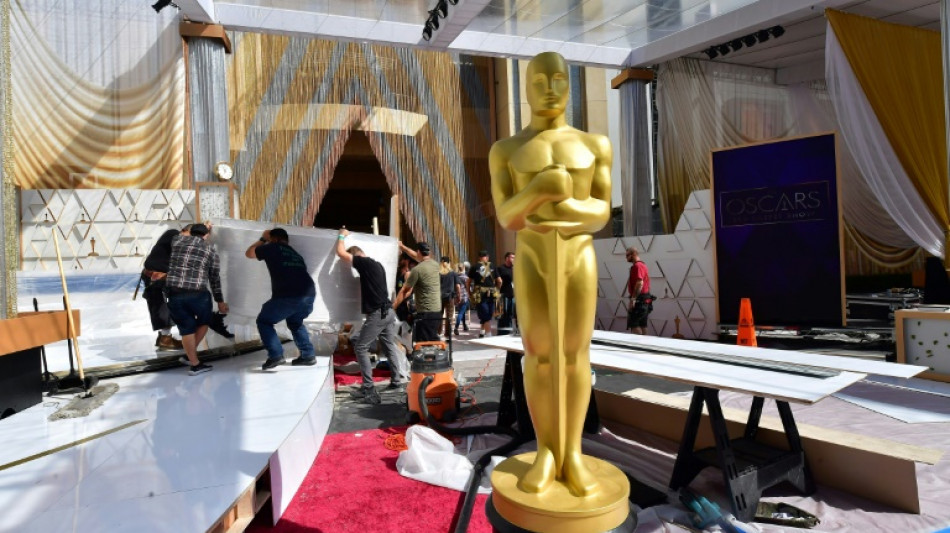 Oscars back in Hollywood as 'CODA' seeks top prize