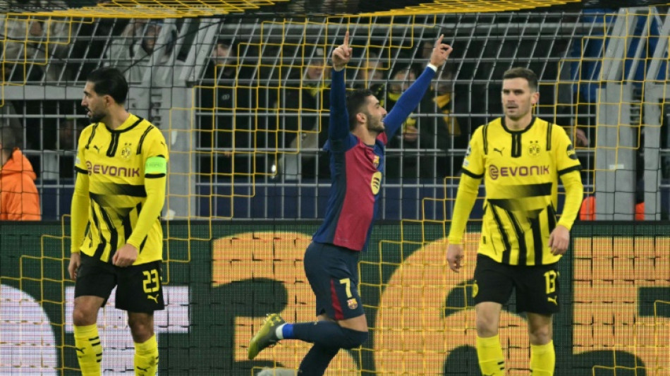 Torres sinks Dortmund to send Barcelona into knockouts