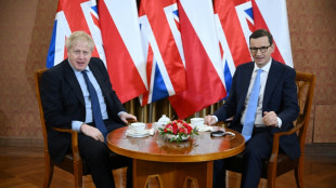 UK warns Putin of indefinite sanctions, war crimes 